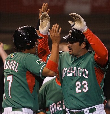 Mexico's Gonzalez celebrates his home run against South Africa with teammete Sandoval during their World Baseball Classic game in Mexico City