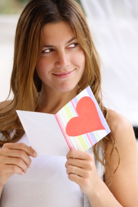 Woman reading valentines day card