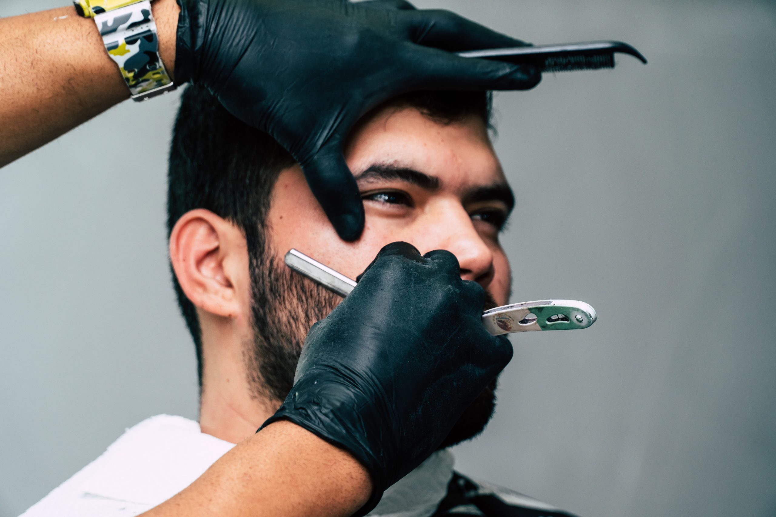 body-confidence-person-shaving-a-man-s-face-with-straight-razor