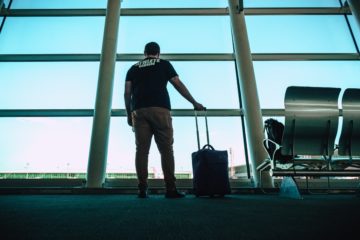 man-holding-luggage-travel_bag