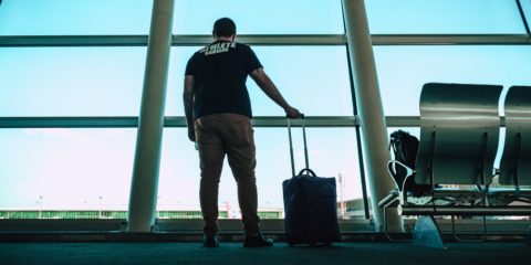 man-holding-luggage-travel_bag