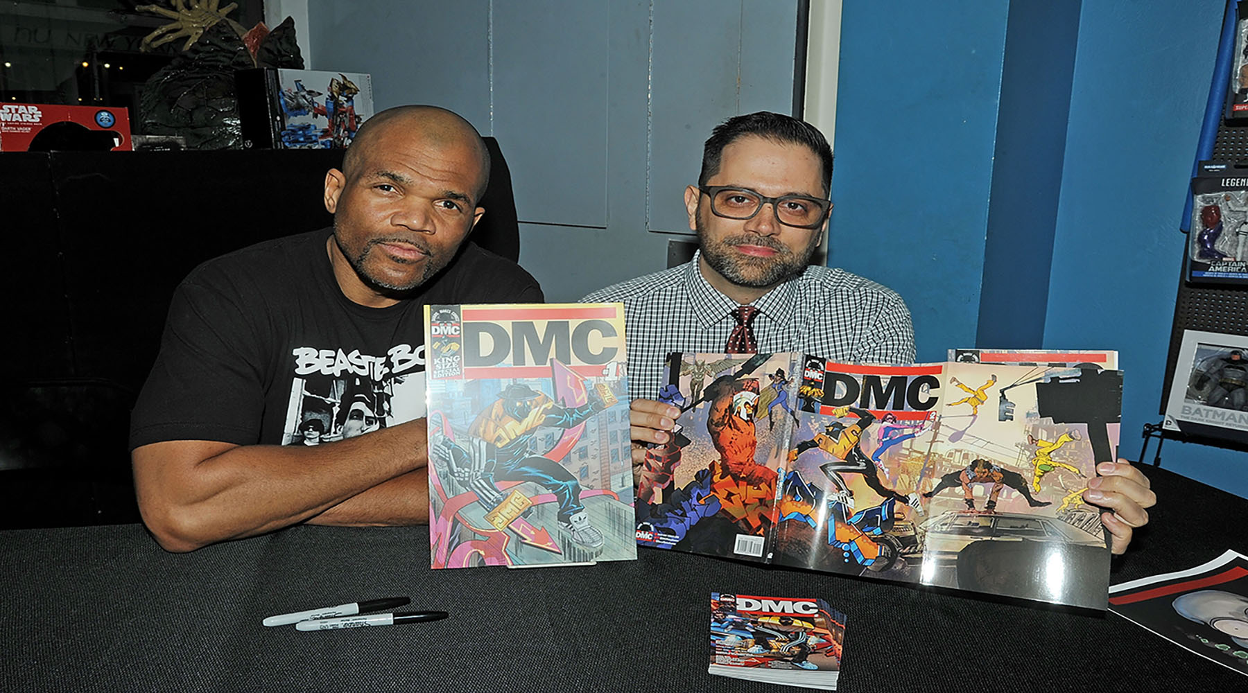 NEW YORK, NY - MARCH 02: Darryl "DMC" McDaniels and Edgardo Miranda Rodriguez signs copies Of "DMC #2" & "Guardians Of Infinity #3" at Forbidden Planet on March 2, 2016 in New York City. (Photo by Bobby Bank/WireImage)