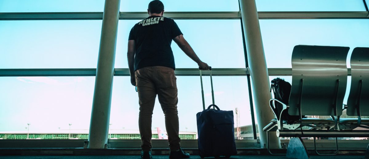 man-holding-luggage-travel_bag